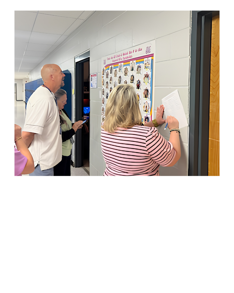 Teachers looking at wall