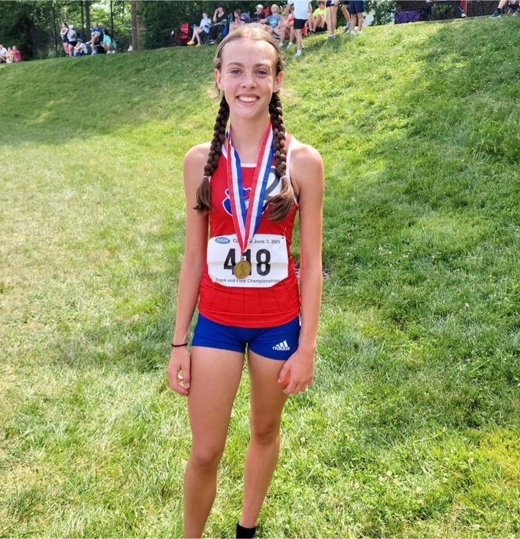 Abby Bastin posing with her 3rd place Metal