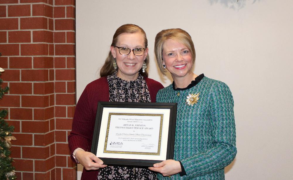 From left, LPS Music Coordinator Amy Thorpe and LPS Supervisor of Music Amy Holloman smile with the All-State music recognition award.