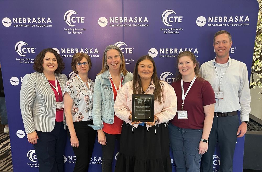 From left, LPS representatives Kristin Vest, Wendy Tullis, Mindy Diller, Bethany Green, Kristin Page and Jason Thomsen smile with the Nebraska Career and Technical Education Outstanding Middle School Programs of 2025 Award.