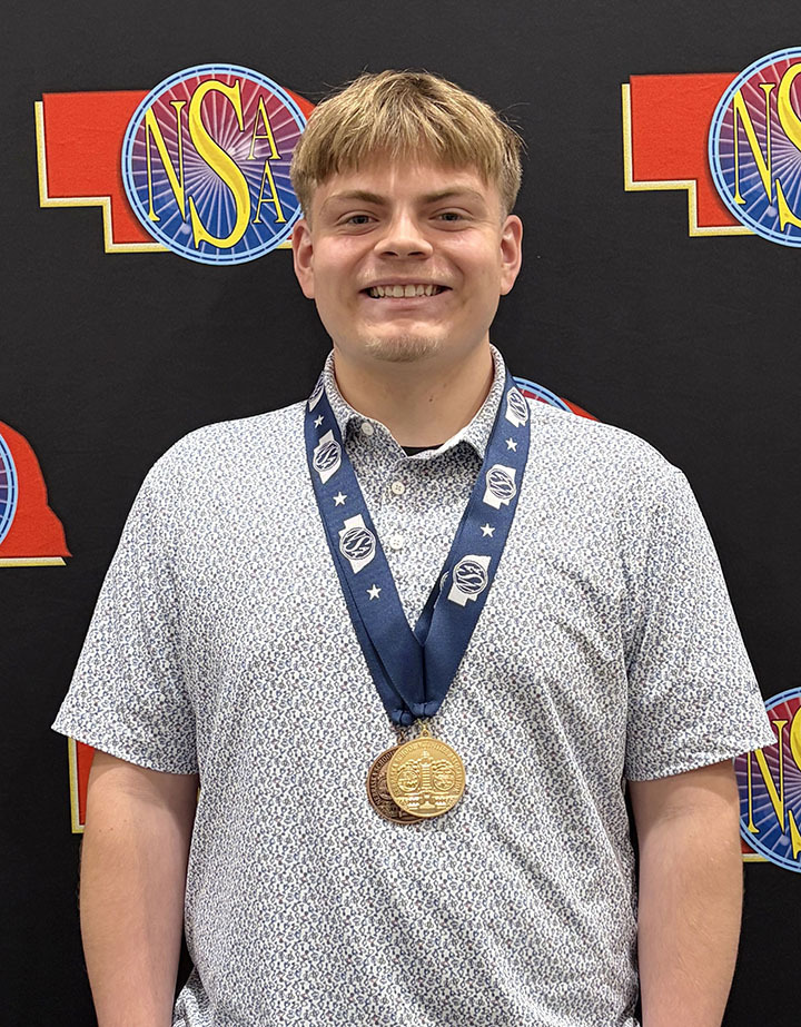 North Star student Ryan Vogt smiles with his state championship medal at the 2026 NSAA State Journalism Championships.