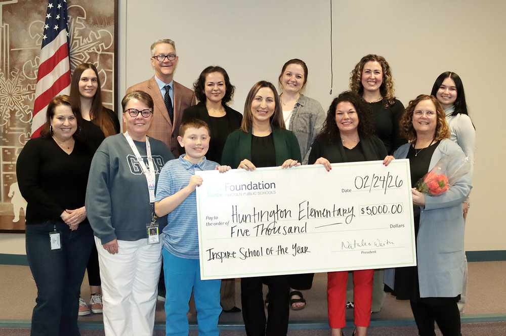 Huntington Elementary School received the 2026 Inspire School of the Year Award from the Foundation for Lincoln Public Schools. Front row from left, Foundation for LPS Development Specialist Molly Oglesby, Huntington Community Learning Centers School Community Coordinator Jeralyn Klingenberg, Huntington fifth grade student Damien Adams, Foundation for LPS President Natalia Wiita, Lincoln Public Schools Director of Elementary Education Gena Licata and Huntington Principal Kristi Schirmer; second row, Foundation for LPS Operations Coordinator Allison Bock, Lincoln Public Schools Superintendent John Skretta, Foundation for LPS Director of Operations Angelina Cunning; Foundation for LPS Operations Specialist Jordan Havlat, Foundation for LPS Director of Engagement Kayla Jacox and Foundation for LPS Marketing Specialist Rukhshona Islamova.