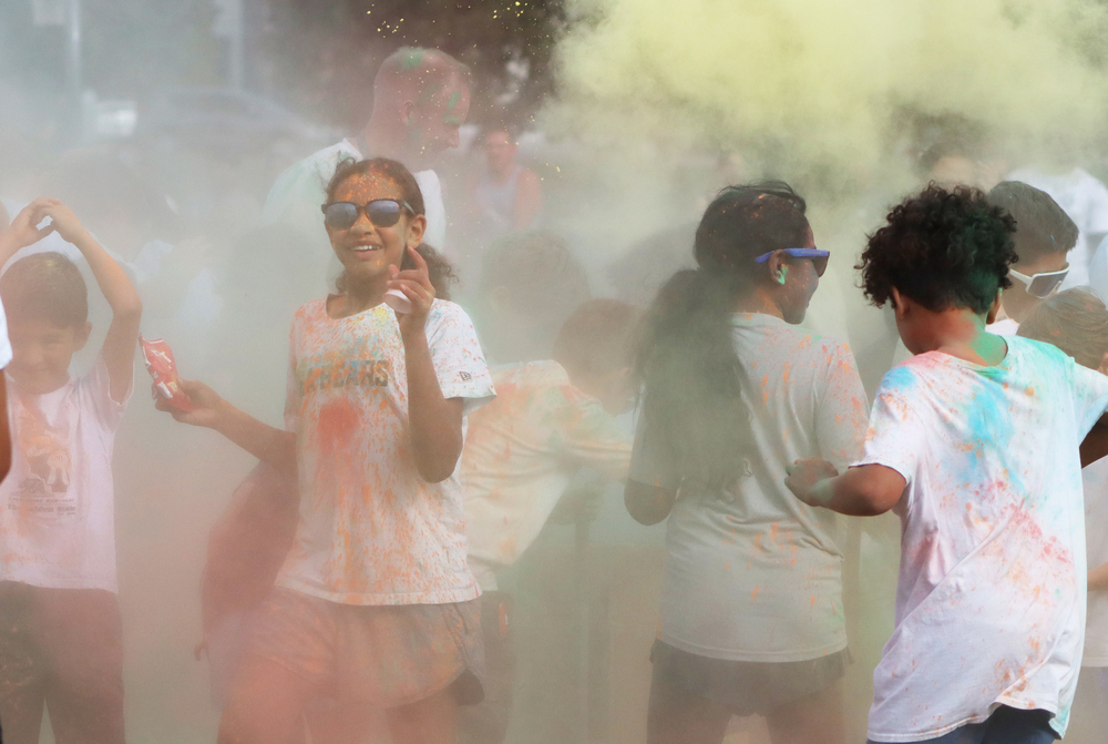 Arnold students standing in a cloud of yellow powder.