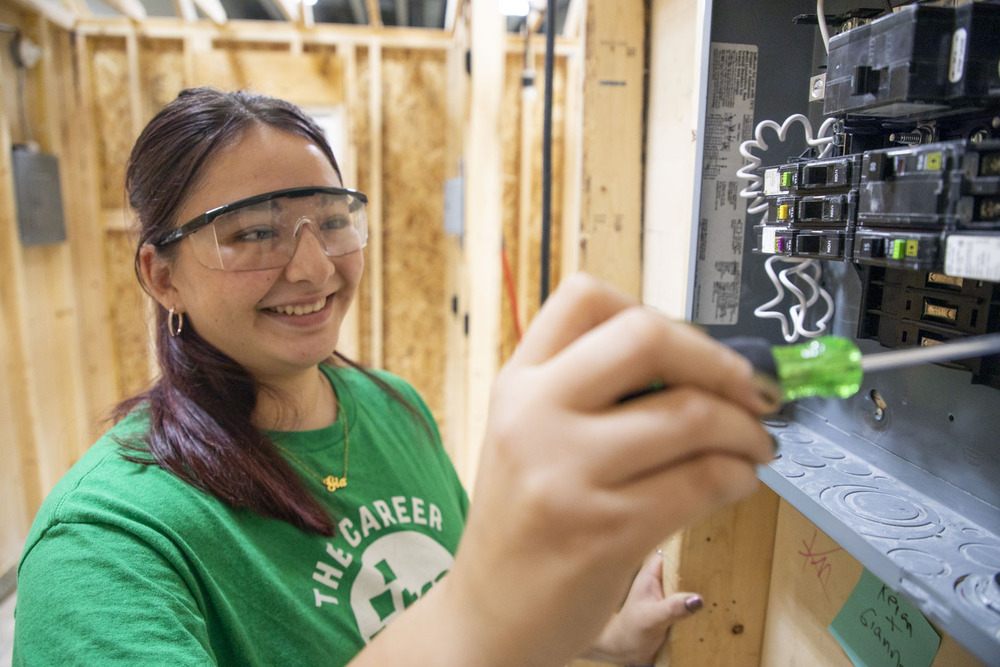 The Career Academy student working on electrical socket