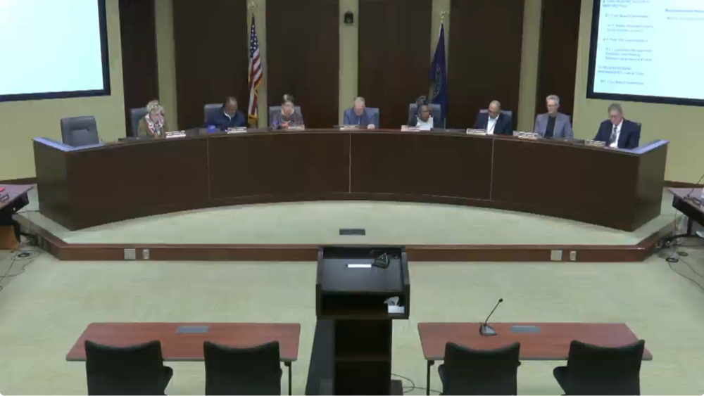 The Lincoln Board of Education sitting at the dias in the boardroom.