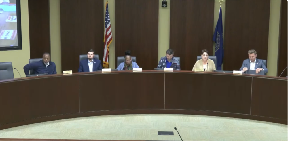 Board of Education members and City Council members at the dias.