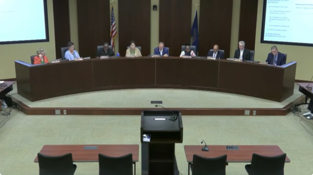 The Board of Education sitting in the Board room during the meeting.