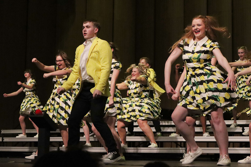 Eight Standing Bear High School students perform their show choir routine on stage during the inaugural The Summit show choir contest.