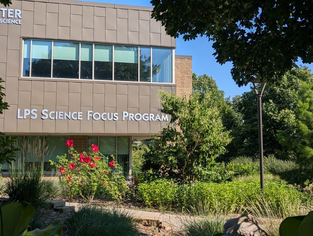 Photo of the LPS Science Focus Program building with pollinator garden out in front.