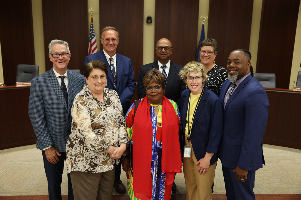 The Lincoln Board of Education standing in the Board room.