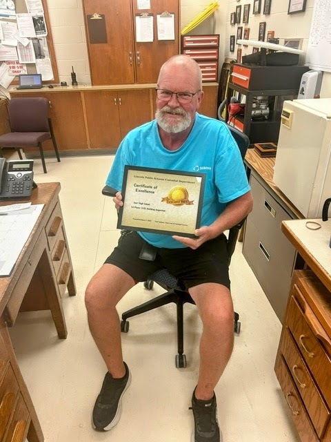 Kevin Connick holding a certificage