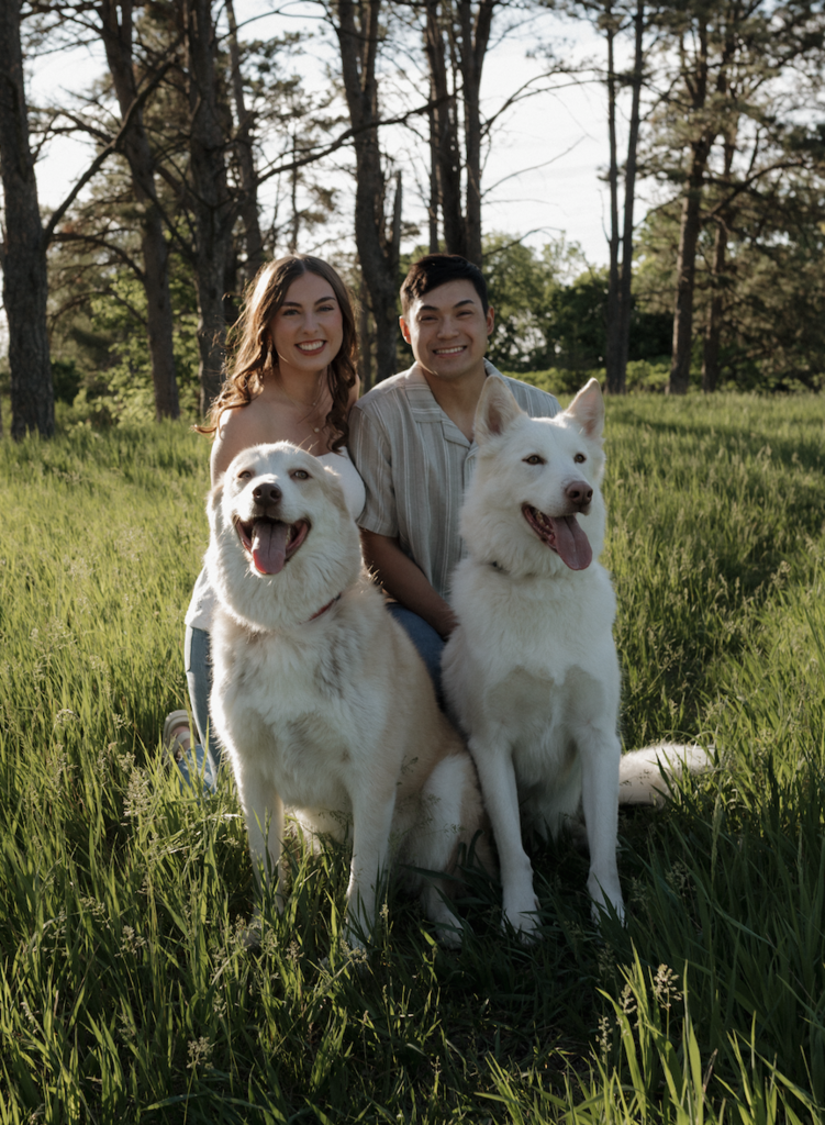 Family photo of Mrs. Sysomphone her Husband Davin and their two Husky dogs Diesel on the left and Zeus on the right.