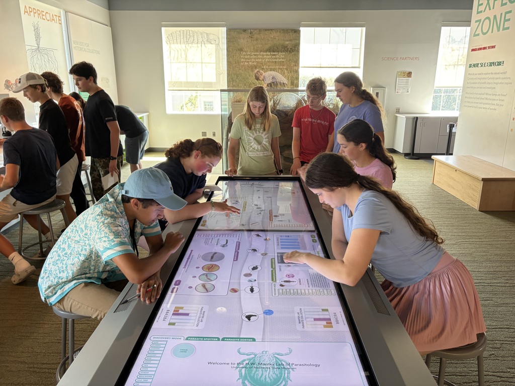 Students exploring interactive table at Morrill Hall.