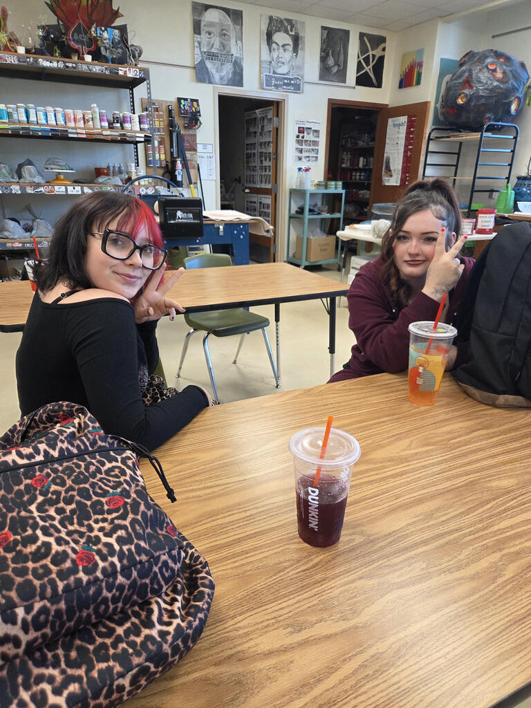 Students talk during art club