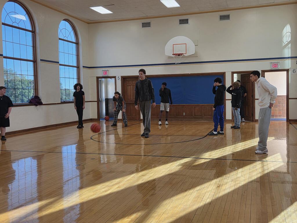 Students play basketball