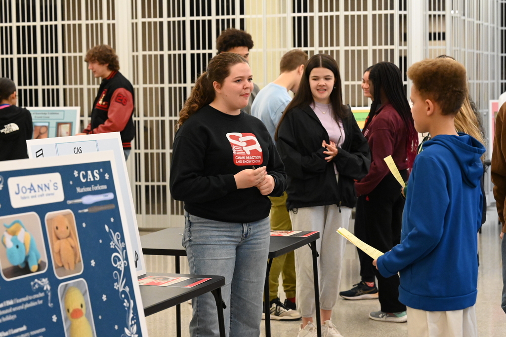 IB student presenting a poster