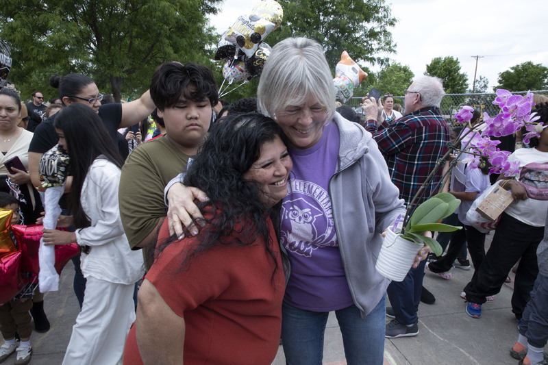 Elliott Elementary Fifth Grade Teacher Rhonda Mueller hugs a student’s mother.