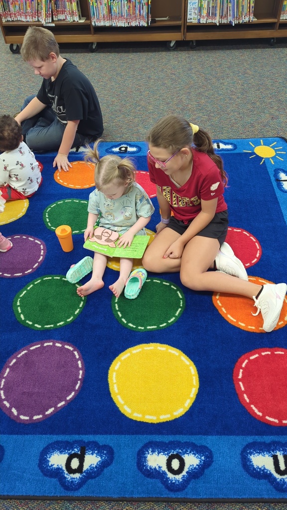 The Little Leopard Learners love their 5th grade reading buddies! 