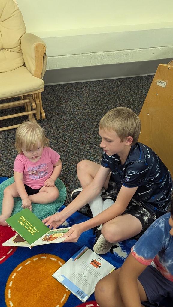 The Little Leopard Learners love their 5th grade reading buddies! 