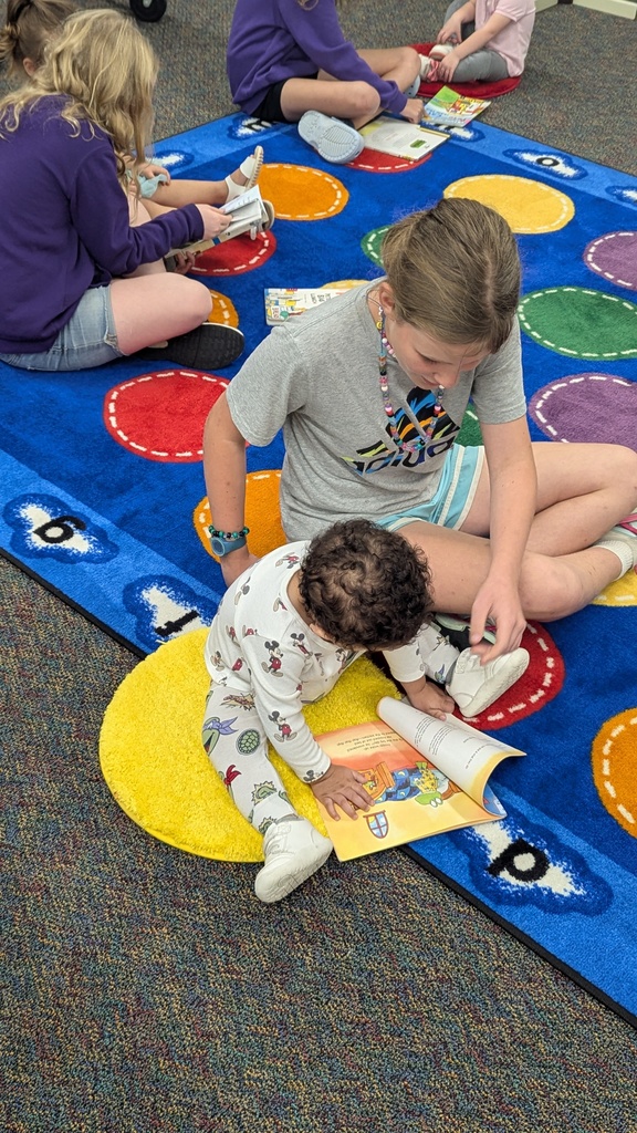 The Little Leopard Learners love their 5th grade reading buddies! 