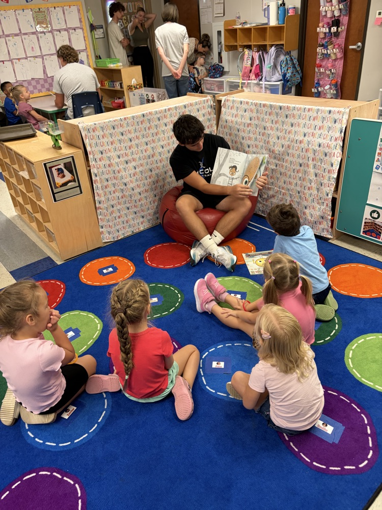football seniors came to read with four year-old preschool