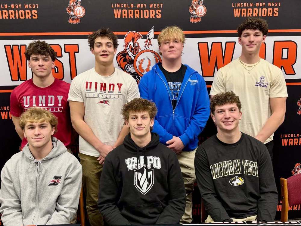 LWW Athletes posing for a photo in front of a West background