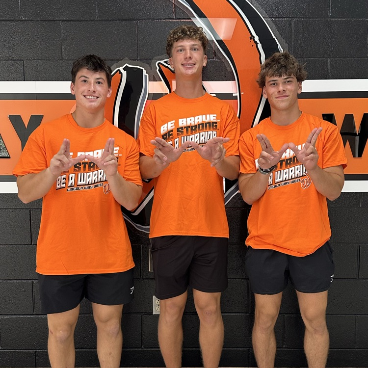 students in orange shirts 