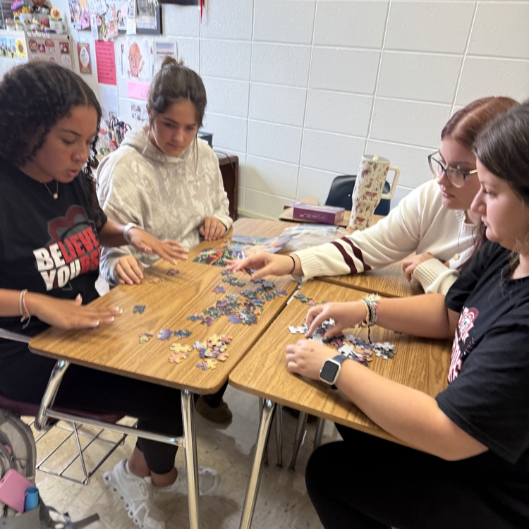 students doing a puzzle
