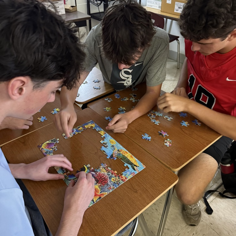 students doing a puzzle
