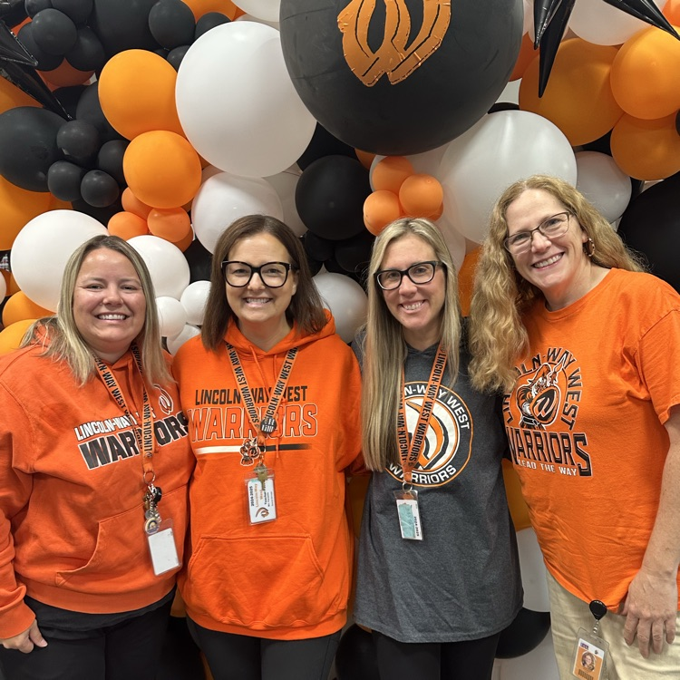 staff wearing orange
