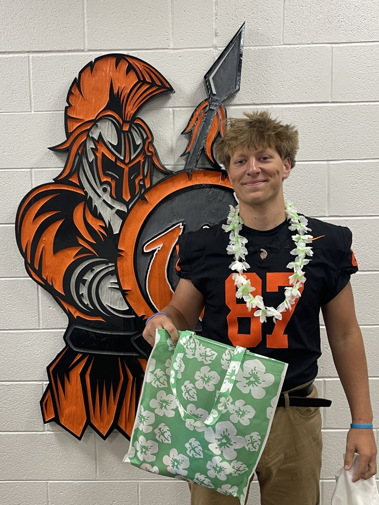 student with tropical bag
