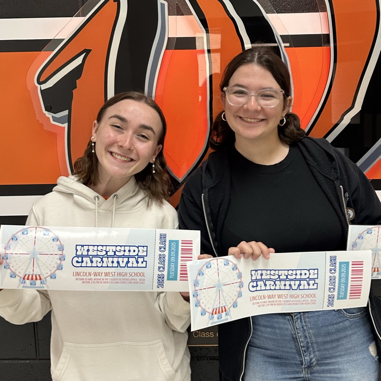 students holding tickets