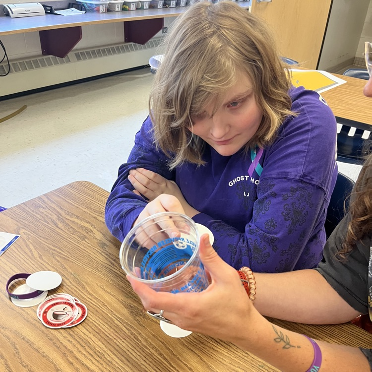 students working on cups