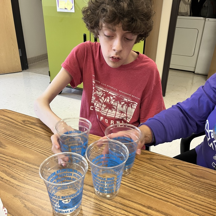 students working on cups