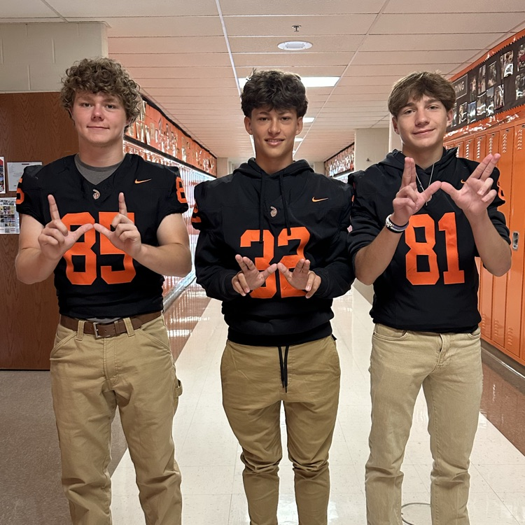 students wearing orange