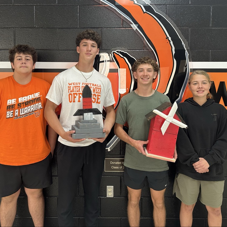 students holding projects
