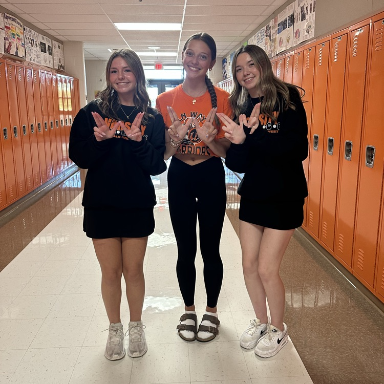 students wearing orange