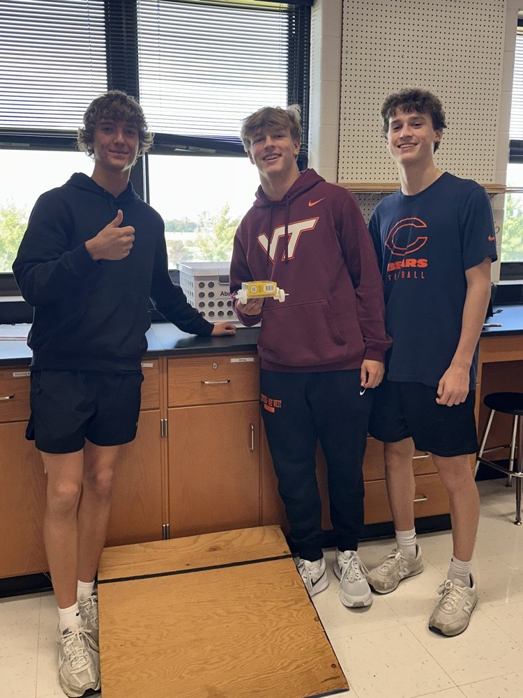 physics students with recycled car