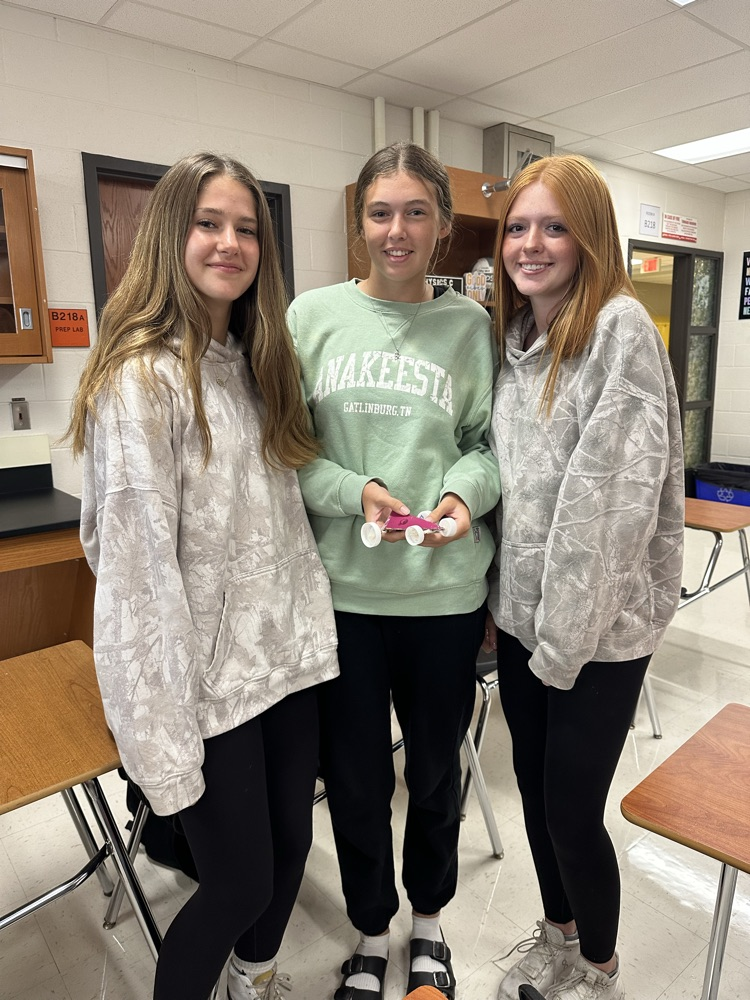physics students with recycled car