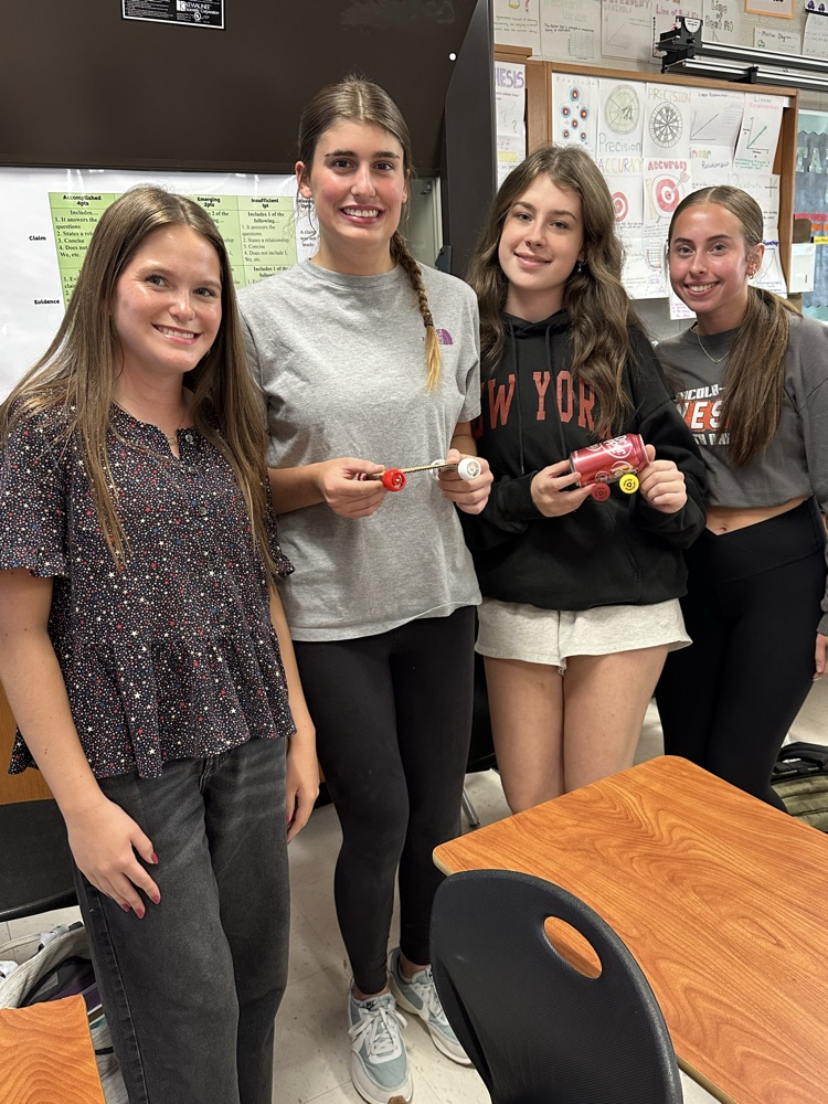 physics students with recycled car