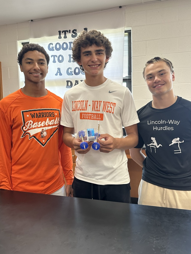 physics students with recycled car