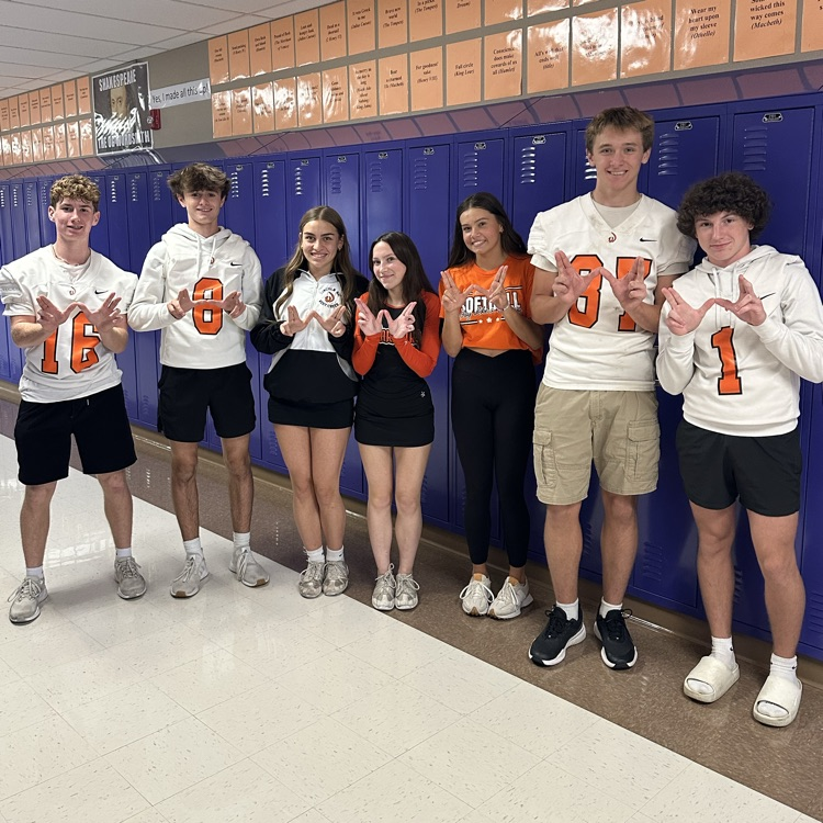students wearing orange