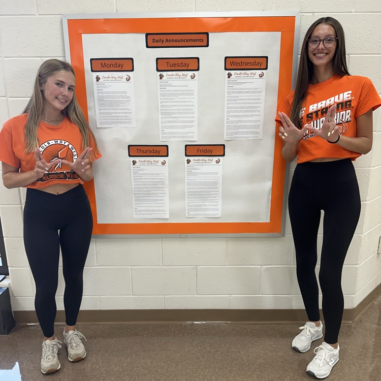 students near announcement board