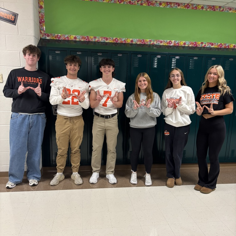 students wearing orange
