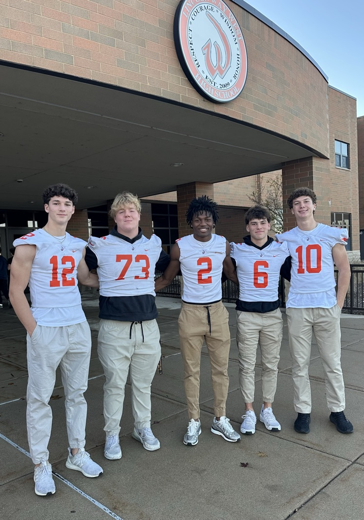 students wearing orange