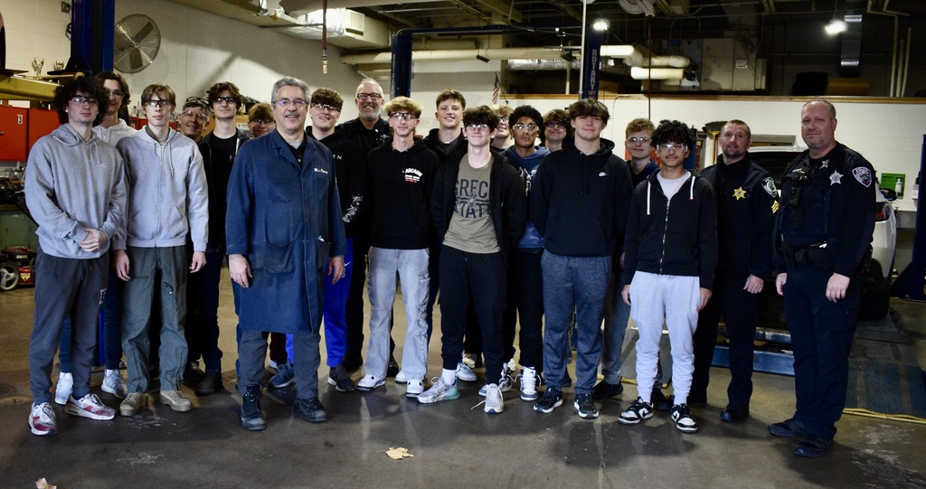 senior vehicle inspections - students and police officers posing for a photo