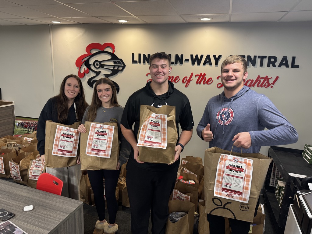 students holding food donation bags