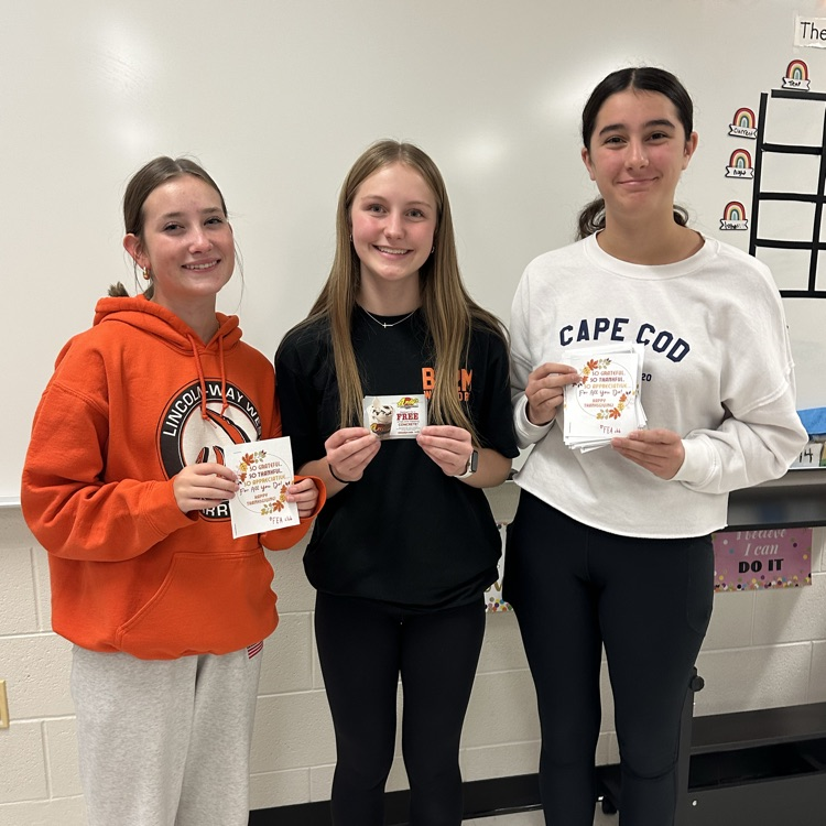 students holding thank yous