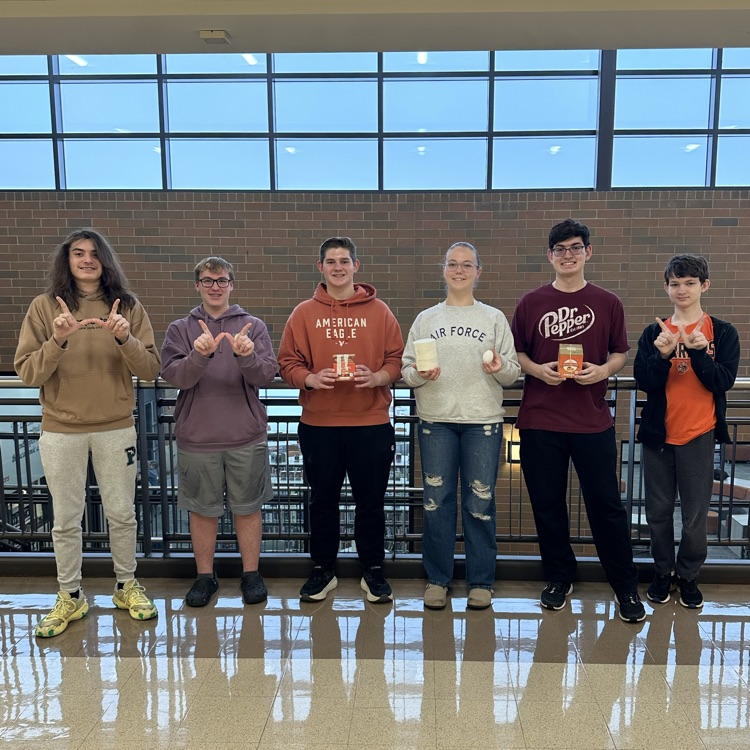 students holding egg drop materials