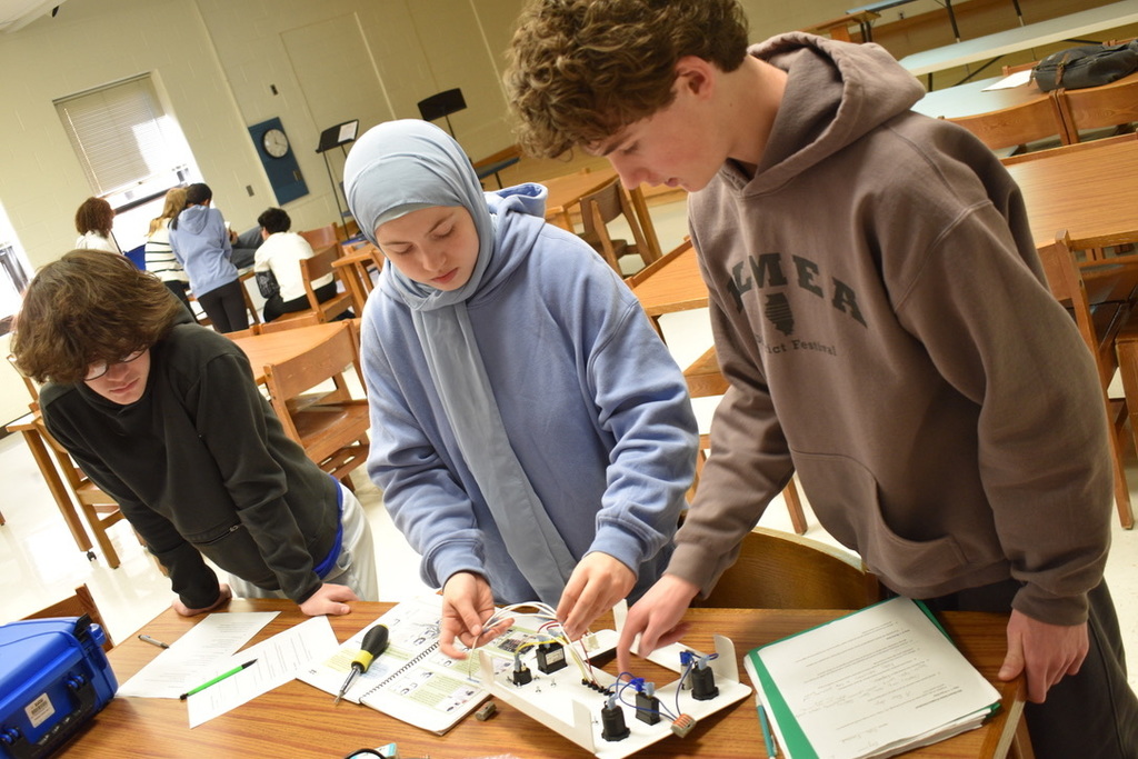 Students working on STEM solar suitcase project